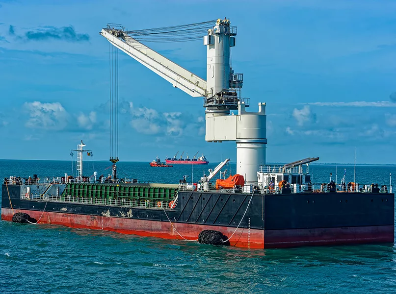 Floating Crane Transhipper with grab feeding system to cater to bauxite ore transhipment operations from barges at outer anchorage of Port Kamsar, Republic of Guinea.