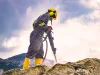 Worker on top of a rock